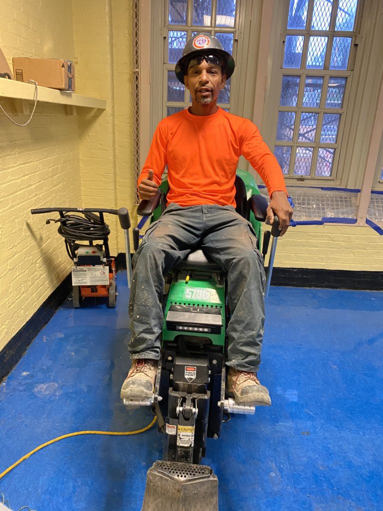 Man sitting on machinery